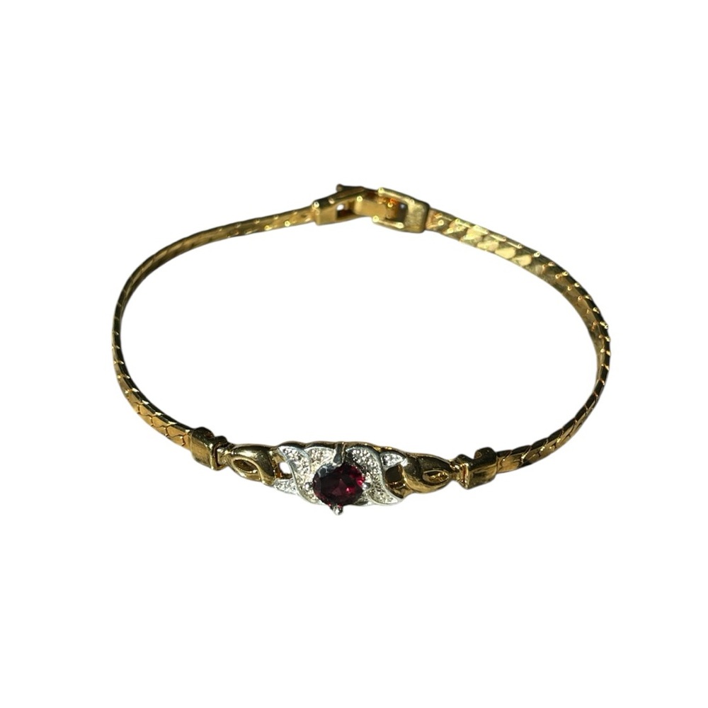 Elegant Gold and Silver Bracelet with Red Gemstone